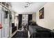 Well-lit bedroom with a single bed, work desk, ceiling fan, and sports-themed decorations at 829 Camargo Way # 211, Altamonte Springs, FL 32714