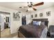 Inviting bedroom featuring stylish decor, a ceiling fan, and access to the en-suite bathroom and closet at 829 Camargo Way # 211, Altamonte Springs, FL 32714