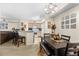 Open-concept dining area with modern lighting and comfortable seating, perfect for gatherings at 829 Camargo Way # 211, Altamonte Springs, FL 32714