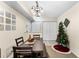 Well-lit dining area featuring tile floors and a Christmas tree at 829 Camargo Way # 211, Altamonte Springs, FL 32714