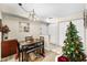 Well-lit dining area featuring carpet floors and a Christmas tree at 829 Camargo Way # 211, Altamonte Springs, FL 32714