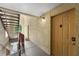 Condo doorway on the second level featuring a hallway and staircase at 829 Camargo Way # 211, Altamonte Springs, FL 32714