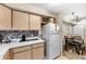 Kitchen features modern appliances, countertop, and a wine rack at 829 Camargo Way # 211, Altamonte Springs, FL 32714