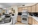 Bright and efficient kitchen space featuring modern appliances and ample counter space at 829 Camargo Way # 211, Altamonte Springs, FL 32714