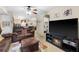 Inviting living room showcasing a comfortable brown sofa, decorative fireplace, and an open layout at 829 Camargo Way # 211, Altamonte Springs, FL 32714