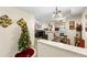 Inviting living room seamlessly connected to the kitchen, complete with festive holiday decorations at 829 Camargo Way # 211, Altamonte Springs, FL 32714