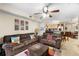 Cozy living room featuring neutral walls with an open concept kitchen at 829 Camargo Way # 211, Altamonte Springs, FL 32714
