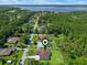 Aerial view highlights the house's location within a neighborhood with a waterfront nearby at 10 Dial Ave, Debary, FL 32713