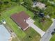 A high-angle aerial view of the home showing driveway, roof, and newly installed landscaping at 10 Dial Ave, Debary, FL 32713