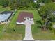 Aerial view of the house showcasing its well-manicured lawn and spacious driveway at 10 Dial Ave, Debary, FL 32713