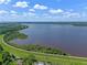 An aerial photograph of a lake on a partly cloudy day at 10 Dial Ave, Debary, FL 32713