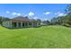 Expansive backyard with lush lawn, a home exterior, boat, and ample space for outdoor activities at 10 Dial Ave, Debary, FL 32713