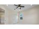 Bright bedroom features a window, closet and modern ceiling fan at 10 Dial Ave, Debary, FL 32713