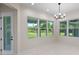 Bright dining room with a modern chandelier and large windows offering outdoor views at 10 Dial Ave, Debary, FL 32713
