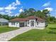 Beautiful single-story home with a brick paver driveway and a well-manicured lawn at 10 Dial Ave, Debary, FL 32713