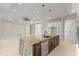 Gourmet kitchen featuring a large island with seating and stainless steel appliances at 10 Dial Ave, Debary, FL 32713