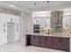 Gourmet kitchen with a large island, stainless steel appliances, and custom cabinetry at 10 Dial Ave, Debary, FL 32713
