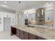 Gourmet kitchen with a large island, stainless steel appliances, and custom cabinetry at 10 Dial Ave, Debary, FL 32713