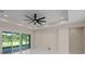 Bright living room featuring recessed lighting, a modern ceiling fan, and large glass doors at 10 Dial Ave, Debary, FL 32713