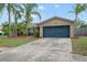 Charming single-story home with a well-maintained lawn, mature palm trees and a two-car garage at 1090 Sonoma Ct, Longwood, FL 32750