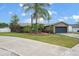 Charming single-story home with well-manicured front lawn, mature landscaping, and a two-car garage at 1090 Sonoma Ct, Longwood, FL 32750