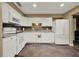 Bright kitchen with white cabinets, laminate countertops, and slate tile flooring at 1090 Sonoma Ct, Longwood, FL 32750