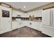 Bright kitchen featuring white cabinets, stone countertops, mosaic backsplash, and slate tile flooring at 1090 Sonoma Ct, Longwood, FL 32750