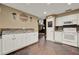 Kitchen with white cabinetry, laminate countertops, slate tile flooring and stainless appliances at 1090 Sonoma Ct, Longwood, FL 32750