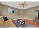 Cozy living room featuring a sofa, area rug, hardwood floors, neutral paint and ceiling fan at 1090 Sonoma Ct, Longwood, FL 32750