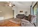 Comfortable living room with neutral paint, ceiling fan, hardwood floors and sliding glass doors at 1090 Sonoma Ct, Longwood, FL 32750
