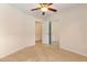 Bedroom with ceiling fan and mirrored closet at 1154 Feather Dr, Deltona, FL 32725