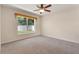 Bedroom with a window overlooking the backyard at 1154 Feather Dr, Deltona, FL 32725