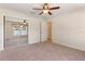 Bedroom featuring a ceiling fan and mirrored closet at 1154 Feather Dr, Deltona, FL 32725
