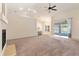 Expansive living room with a fireplace, a breakfast bar, and sliding glass doors leading to a pool area at 1154 Feather Dr, Deltona, FL 32725