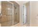 Tiled shower with glass door and a built-in seat at 1154 Feather Dr, Deltona, FL 32725