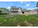 Large backyard with a screened in porch and a well maintained lawn at 1225 Hollow Pine Dr, Oviedo, FL 32765