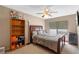 Bedroom features a ceiling fan, a window and a bookcase at 1225 Hollow Pine Dr, Oviedo, FL 32765