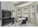 Eat-in kitchen area with a breakfast table, recessed lights, and stainless steel oven at 1225 Hollow Pine Dr, Oviedo, FL 32765