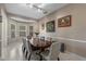 Formal dining room with large wood table, seating for eight, and a bay window with natural light at 1225 Hollow Pine Dr, Oviedo, FL 32765