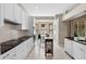 Bright kitchen featuring white cabinets, black countertops, modern appliances, and breakfast nook with bay window at 1225 Hollow Pine Dr, Oviedo, FL 32765