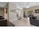 Living room featuring a breakfast bar, open floor plan, tile floors, and views to the outdoor patio at 1225 Hollow Pine Dr, Oviedo, FL 32765