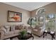 Inviting living room with comfortable seating, a stylish coffee table, and ample natural light, creating a warm atmosphere at 1225 Hollow Pine Dr, Oviedo, FL 32765