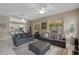 Spacious living room featuring tile floors, neutral colors, ceiling fans, and comfortable seating at 1225 Hollow Pine Dr, Oviedo, FL 32765