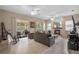 Cozy living room with fireplace, comfortable seating, and sliding glass doors to outdoor space at 1225 Hollow Pine Dr, Oviedo, FL 32765
