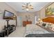 This main bedroom is spacious with a ceiling fan and a door to the hallway at 1225 Hollow Pine Dr, Oviedo, FL 32765