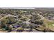 Aerial view of a home surrounded by trees and a blue-lined border at 12419 Eryn Ct, Clermont, FL 34711
