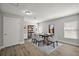 Dining room with laminate floors, neutral walls, modern furniture, and natural light at 12419 Eryn Ct, Clermont, FL 34711