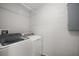 Well-lit laundry room featuring a modern Samsung washer and dryer at 12419 Eryn Ct, Clermont, FL 34711
