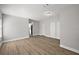 Spacious living room features laminate flooring, white trim and neutral walls at 12419 Eryn Ct, Clermont, FL 34711