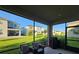 Screened-in lanai overlooks a well-maintained backyard and neighboring homes at 1259 Pando Loop, Orlando, FL 32824